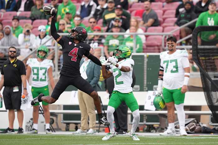 Sep 30, 2023; Stanford, California, USA; Stanford Cardinal cornerback Zahran Manley (4) defends a pass intended for Oregon Ducks wide receiver Gary Bryant Jr. (2) during the second quarter at Stanford Stadium. Mandatory Credit: Darren Yamashita-USA TODAY Sports